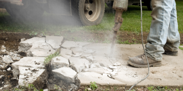 breaking a concrete sidewalk